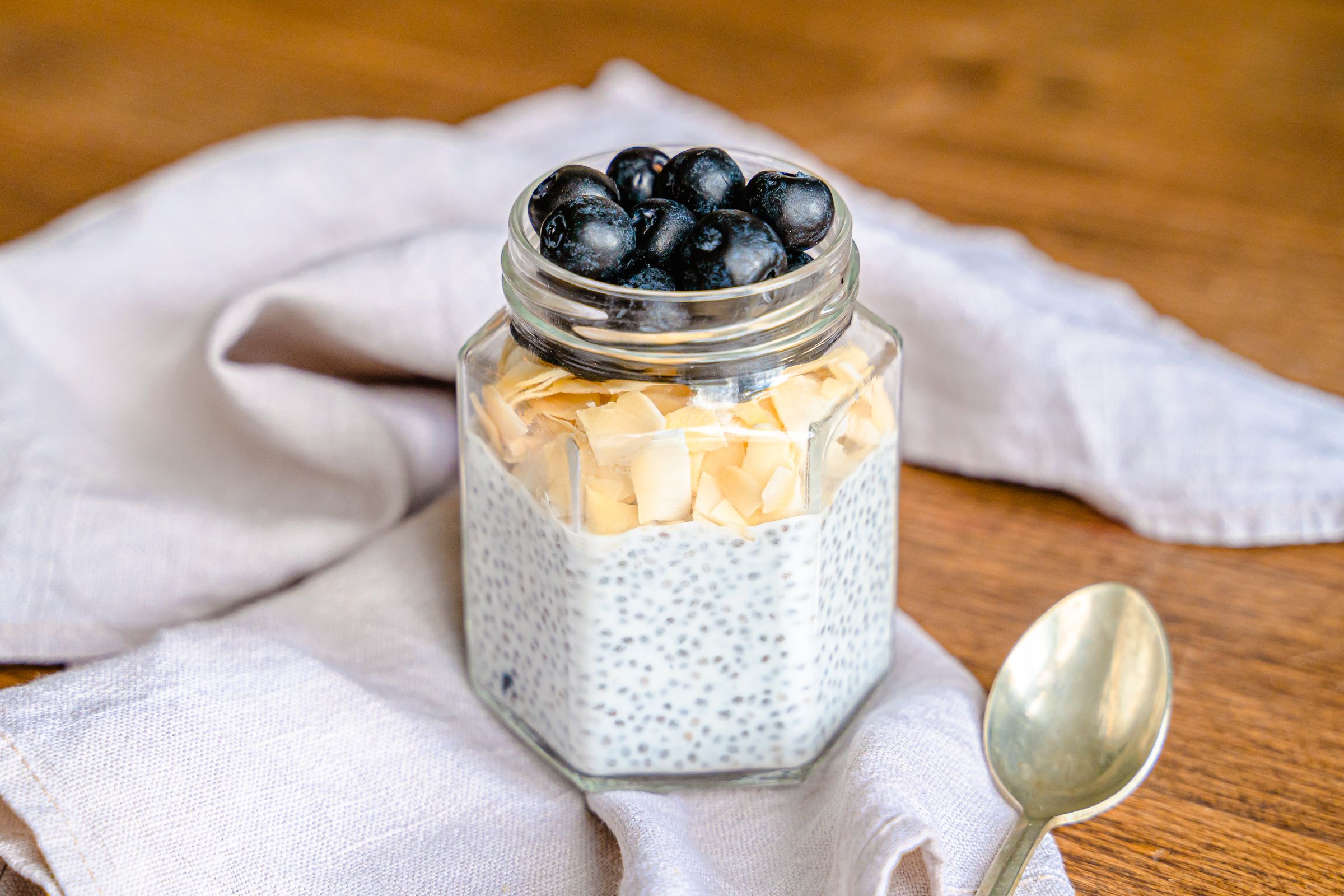 Chia seeds swollen into a thick gel-like pudding topped with fresh fruit